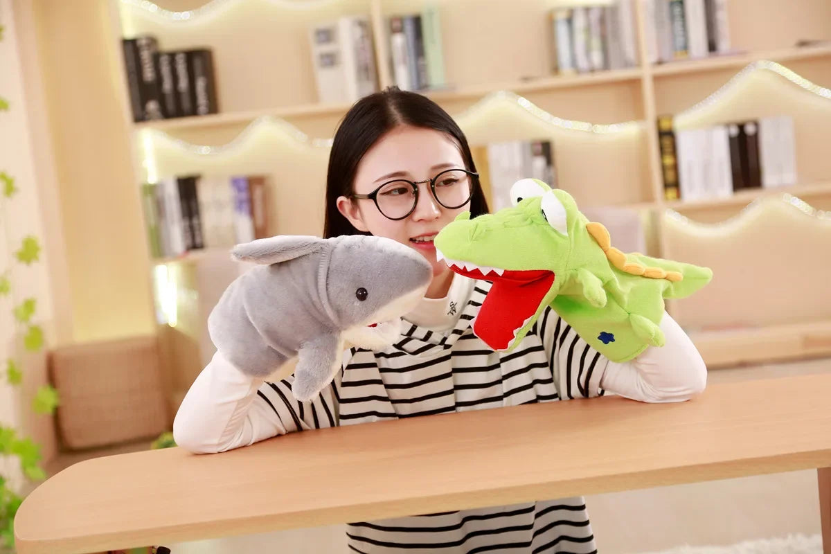 Person holding a shark and dinosaur plush toy in a room with bookshelves.