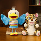 Plush toys of a butterfly and a leopard on a wooden surface with a blurred background.